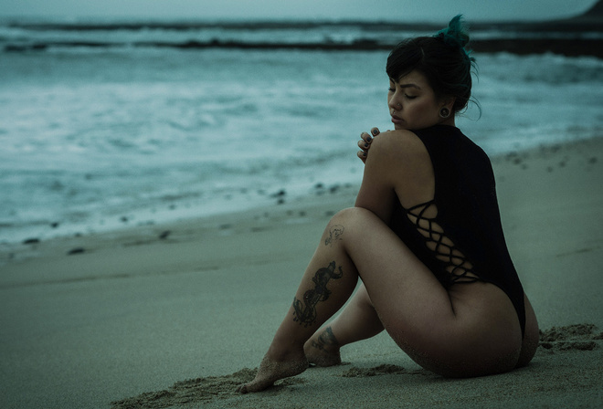 women, tanned, one-piece swimsuit, ass, sand, sea, women outdoors, tattoo, sitting, dyed hair, painted nails, pierced nose, closed eyes, depth of field