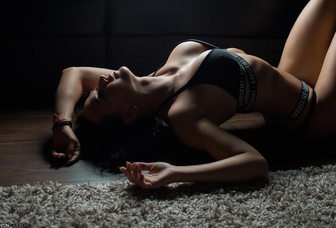 women, black lingerie, tanned, belly, ribs, lying on back, on the floor, wooden surface, pink nails