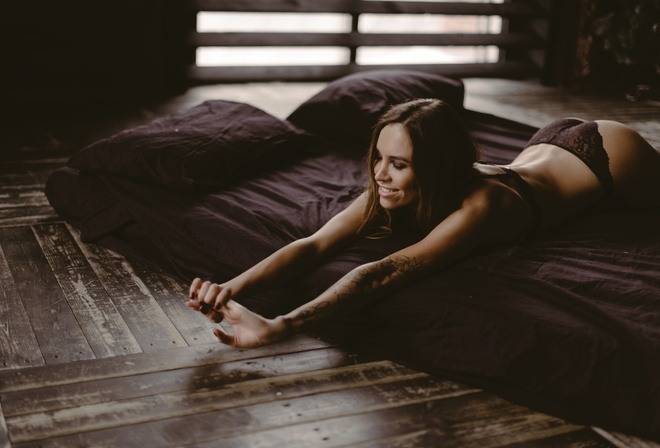 women, lying on front, closed eyes, ass, tanned, red nails, lingerie, pillow, wooden surface, tattoo