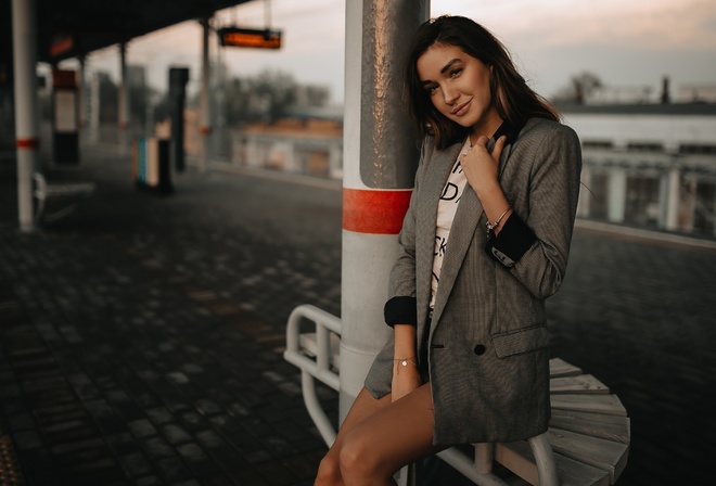 women, tanned, train station, portrait, jean shorts, smiling