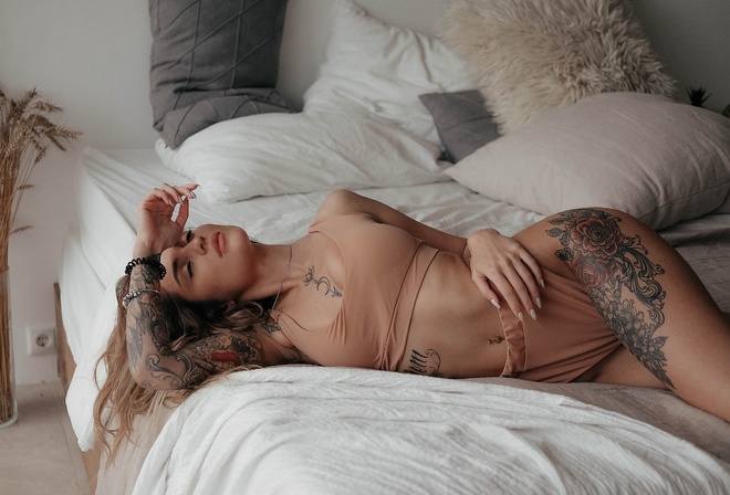 women, brunette, closed eyes, pierced navel, tattoo, underwear, in bed, pillow