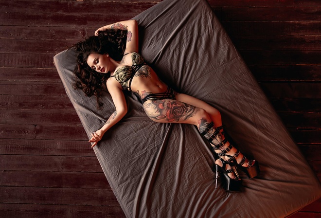 women, high heels, tattoo, in bed, top view, red lipstick, brunette, belly, pierced navel, wooden floor, lingerie