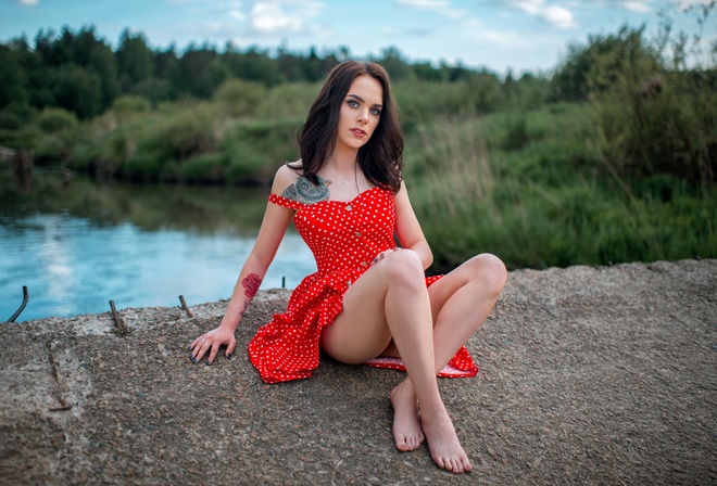 women, red dress, polka dots, women outdoors, tattoo, sitting, ass, blue nails, river, bare shoulders, pierced nose, gray eyes, red lipstick