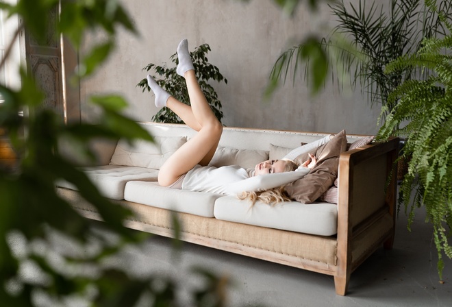 women, blonde, white clothing, women indoors, couch, white socks, plants, window, closed eyes, feet in the air