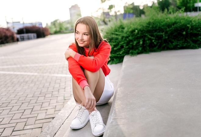 model, women, brunette, women outdoors, miniskirt, skirt, sweater, sneakers, plants, smiling, street