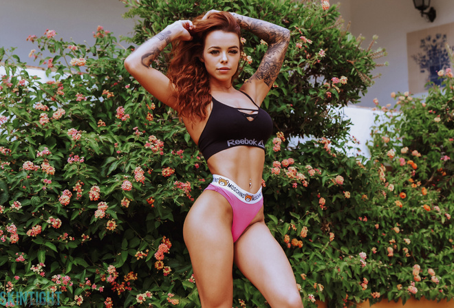 Skin Tight Glamour, sportswear, sports bra, Reebok, women, model, redhead, hips, ass, flowers, tattoo, plants, pink panties, pierced navel, women outdoors