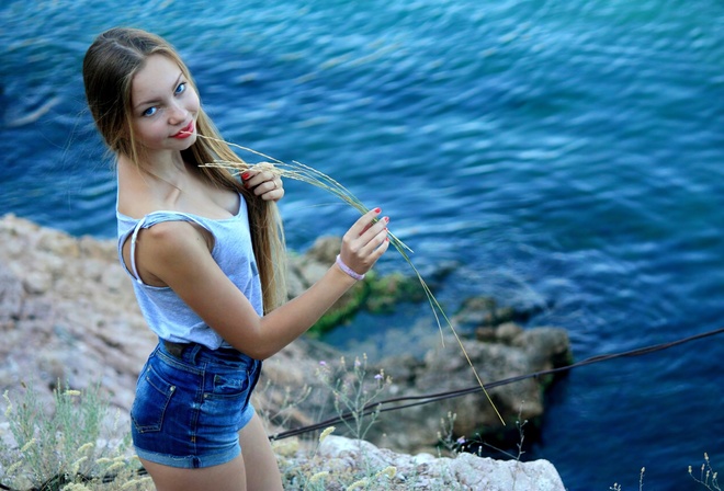 jean shorts, beach, blonde, tank top, , looking at viewer, red lipstick, women outdoors, sea, blue eyes