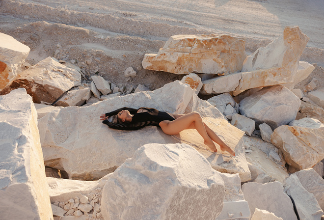 , women outdoors, hips, blonde, bodysuit, sky, clouds, rocks, model, black bodysuit, women, ass, nature, lying on back, closed eyes