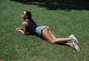 woment, anned, T-shirt, jean shorts, sunglasses, women outdoors, sneakers, ass, lying on front, grass