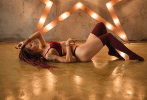 women, dreadlocks, red lingerie, stockings, on the floor, tattoo, brunette, dyed hair, lying on back, ass, closed eyes, painted nails, belly, ribs