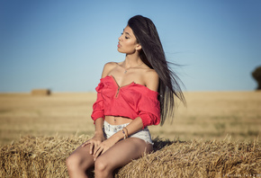 women, jean shorts, sitting, women outdoors, sky, tanned, belly, pierced navel, necklace, bare shoulders, hay, long hair