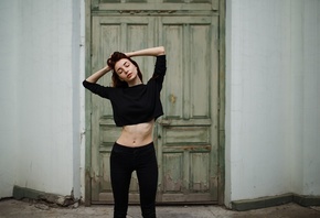 women, black clothing, closed eyes, jeans, hands on head, ribs