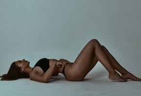 women, tanned, lying on back, ass, closed eyes, simple background, black panties, Black top