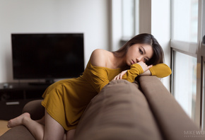 women, Asian, kneeling, couch, TV, window, yellow dress, portrait