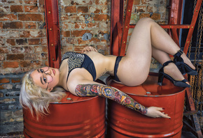 women, ass, women with glasses, tattoo, high heels, barrels, blue lingerie, chains, red nails, blonde, dyed hair, women indoors, wall, bricks, eyeliner