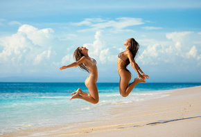 women, jumping, beach, ass, sky, clouds, two women, sand, sea, smiling, rib ...
