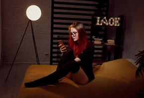 women, dyed hair, Batman logo, in bed, black stockings, panties, sitting, glasses, wall, books, black t-shirt, cellphone, women with glasses