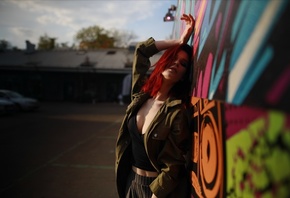 Irina Telicheva, model, women, redhead, women outdoors, jacket, striped pants, public, graffiti, sky, clouds, closed eyes