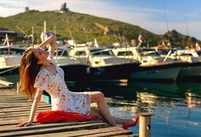 women, model, blonde, women outdoors, bay, dress, red shoes, heeled shoes, hill, sky, clouds, nature, sitting, boat, smiling