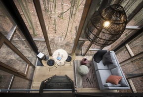 tree house, glass cabin, minimalist architecture, luxurious sanctuary, Belgian Ardennes