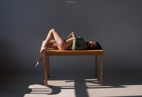 Nil Volkov, women, model, brunette, tattoo, on table, women indoors, ass, hips, table, bodysuit, gray wall, legs, , 