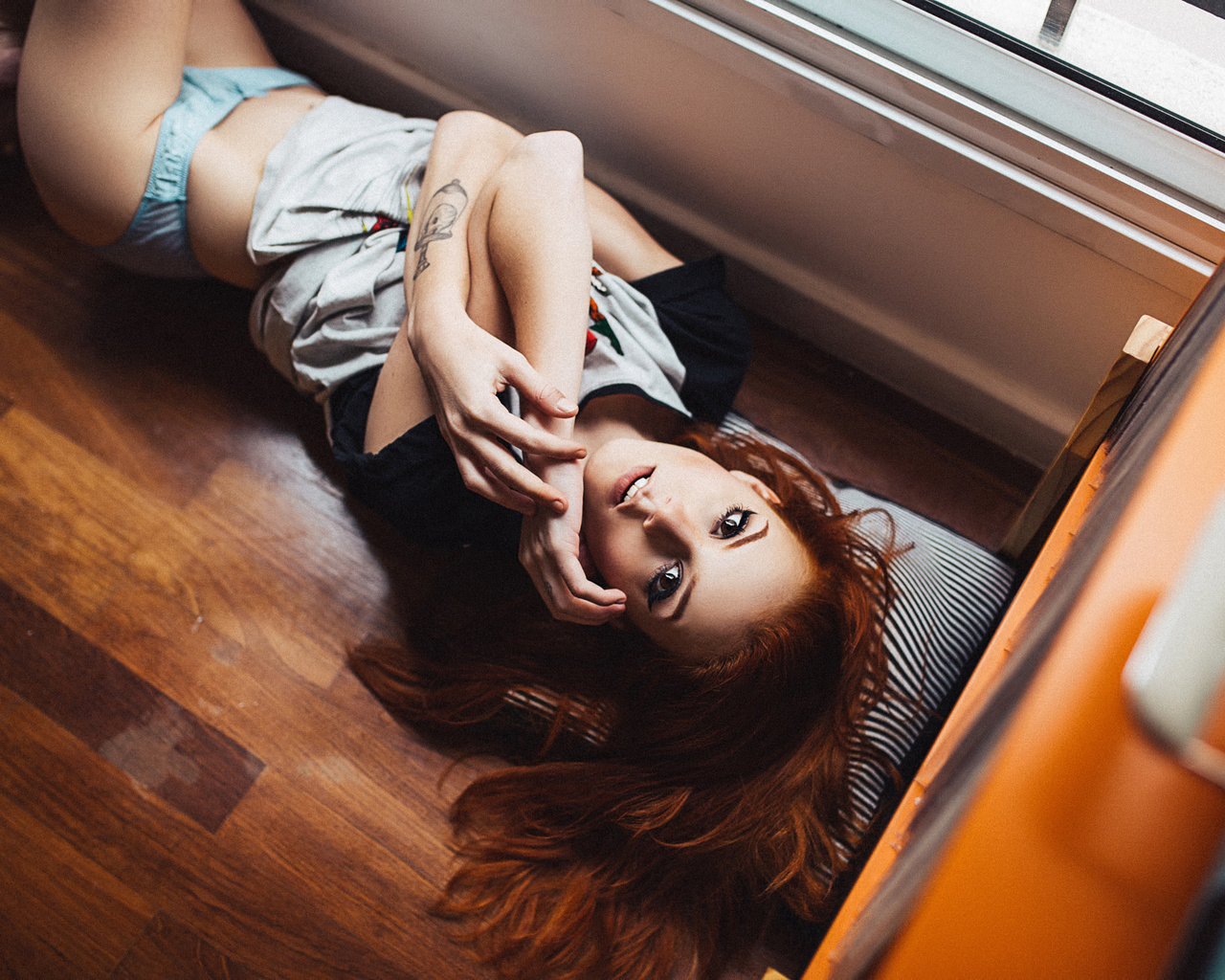 elisa rios, women, redhead, lingerie, thong, wooden surfac, eon the floor, looking at viewer, brunette, tattoo, henrique cesar, t-shirt