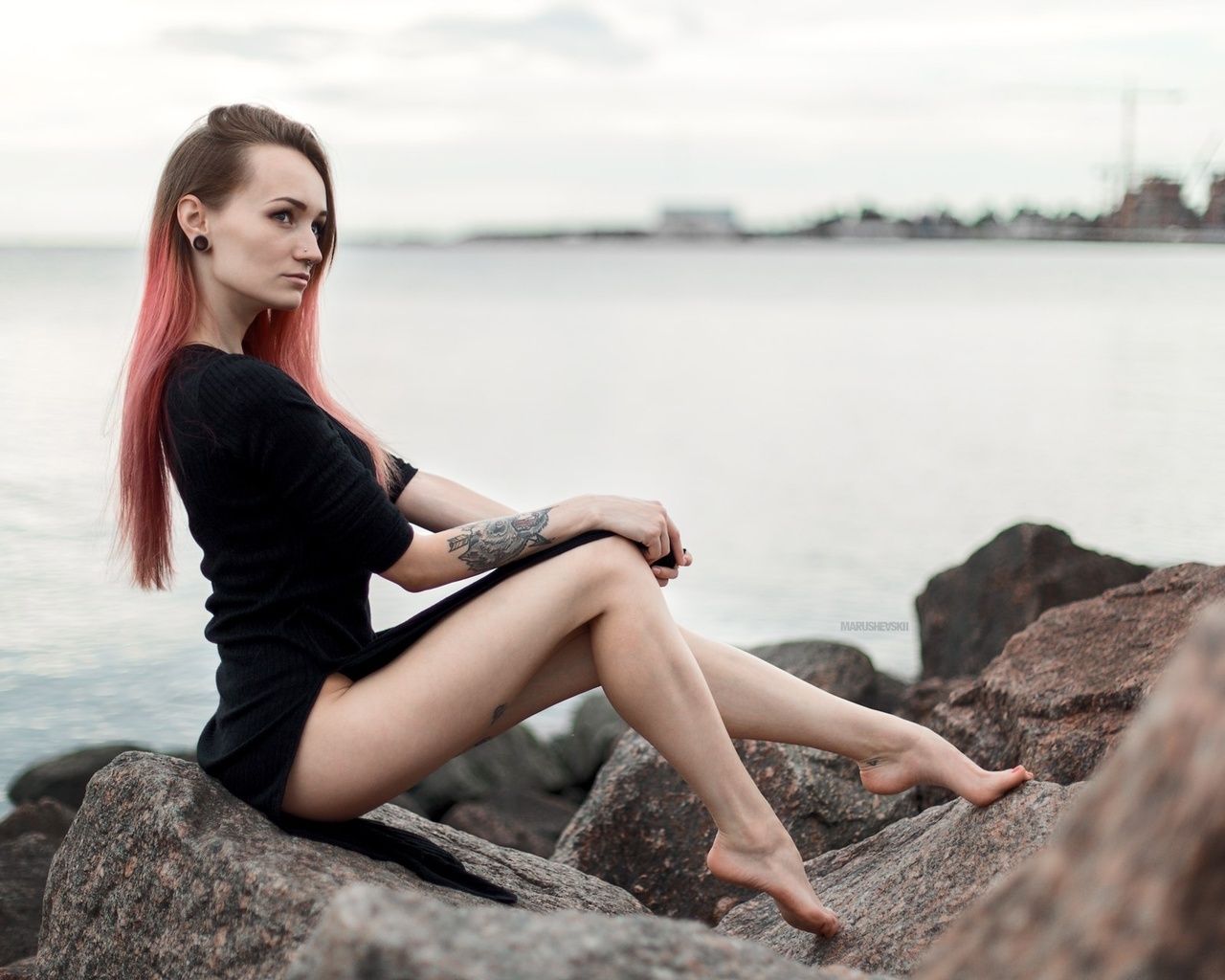 julia tyki, women, skinny, black dress, dyed hair, rocks, sea, tattoos, portrait, pierced nose, nose rings, long hair, sitting