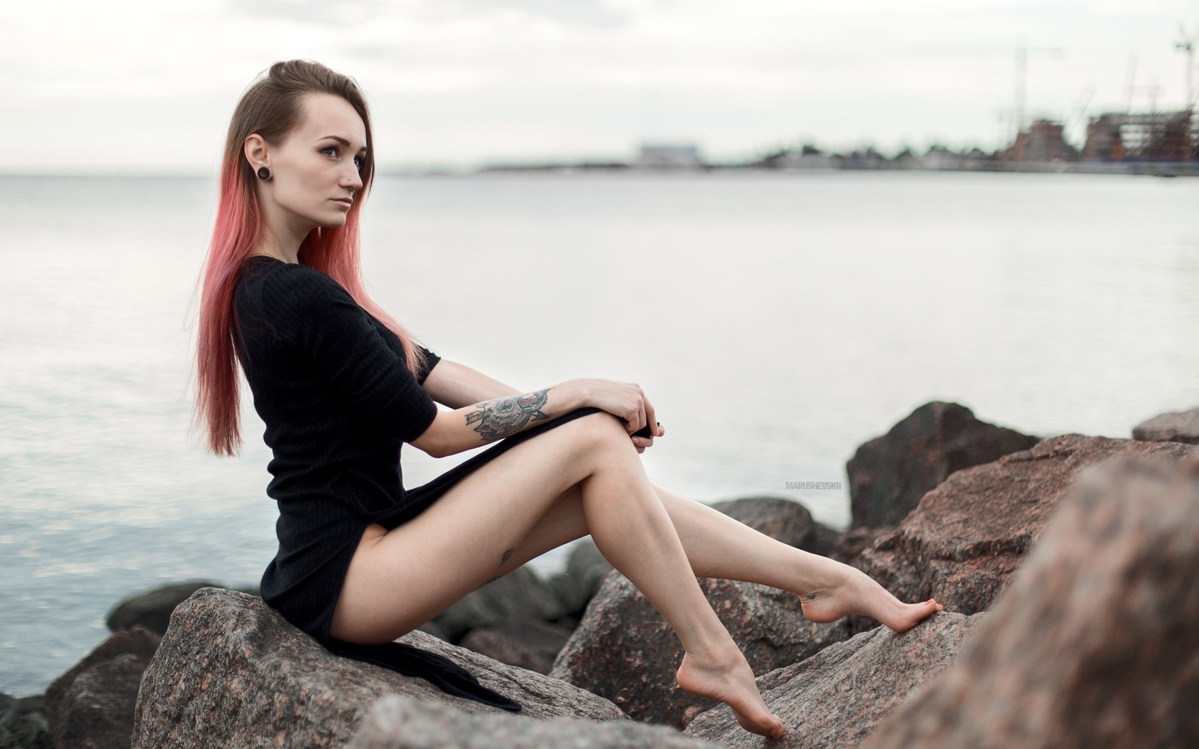 julia tyki, women, skinny, black dress, dyed hair, rocks, sea, tattoos, portrait, pierced nose, nose rings, long hair, sitting