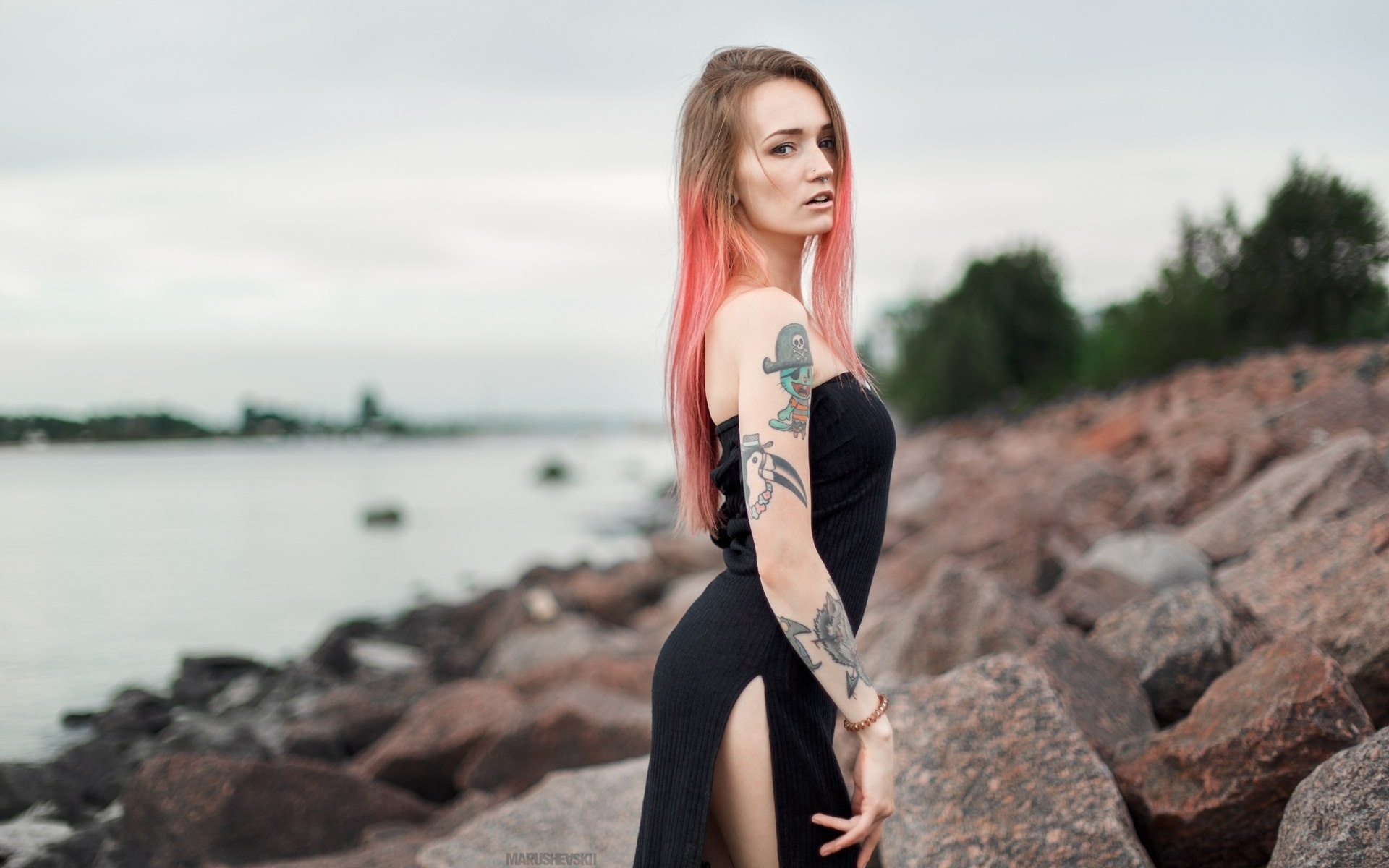 julia tyki, women, skinny, black dress, dyed hair, rocks, sea, tattoos, portrait, nose rings, pierced nose, looking at viewer, long hair, depth of field