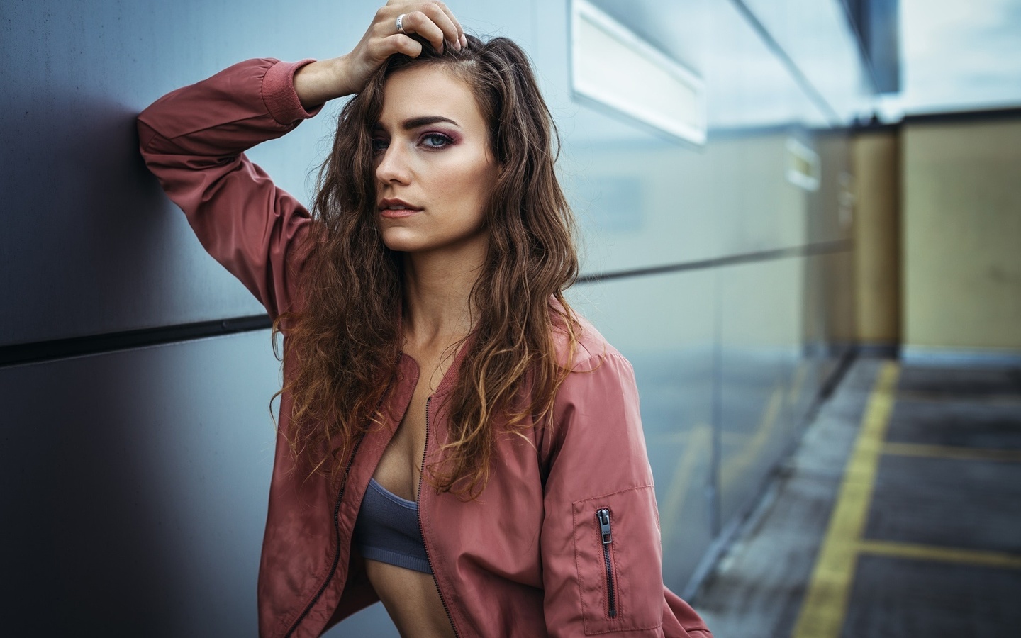 women, wavy hair, portrait, wall, hands on head, sweater, depth of field