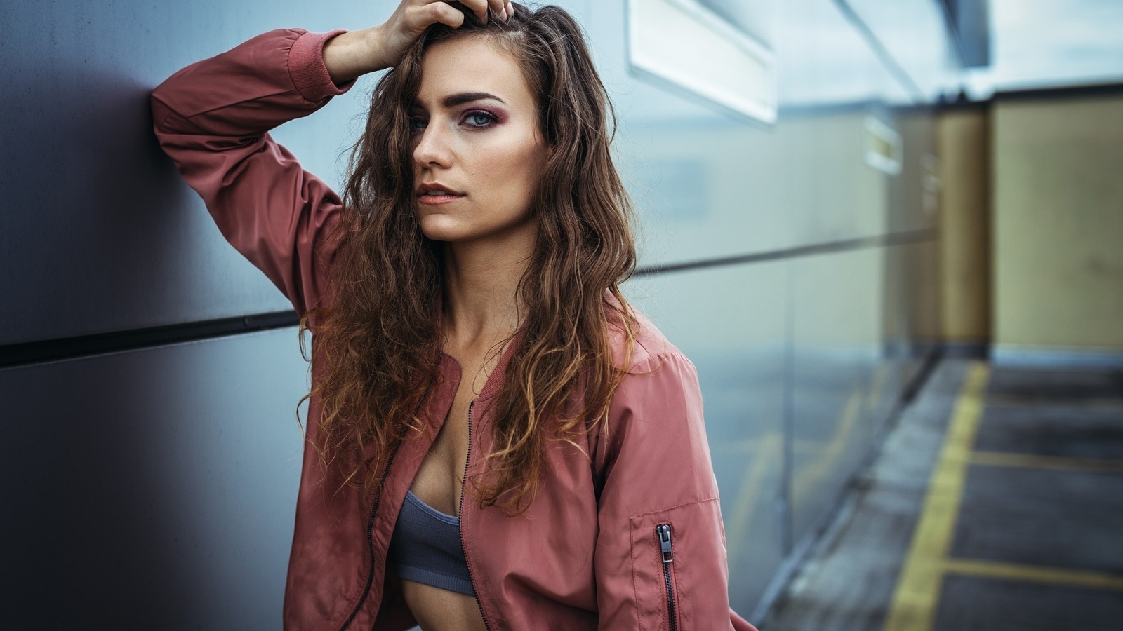 women, wavy hair, portrait, wall, hands on head, sweater, depth of field