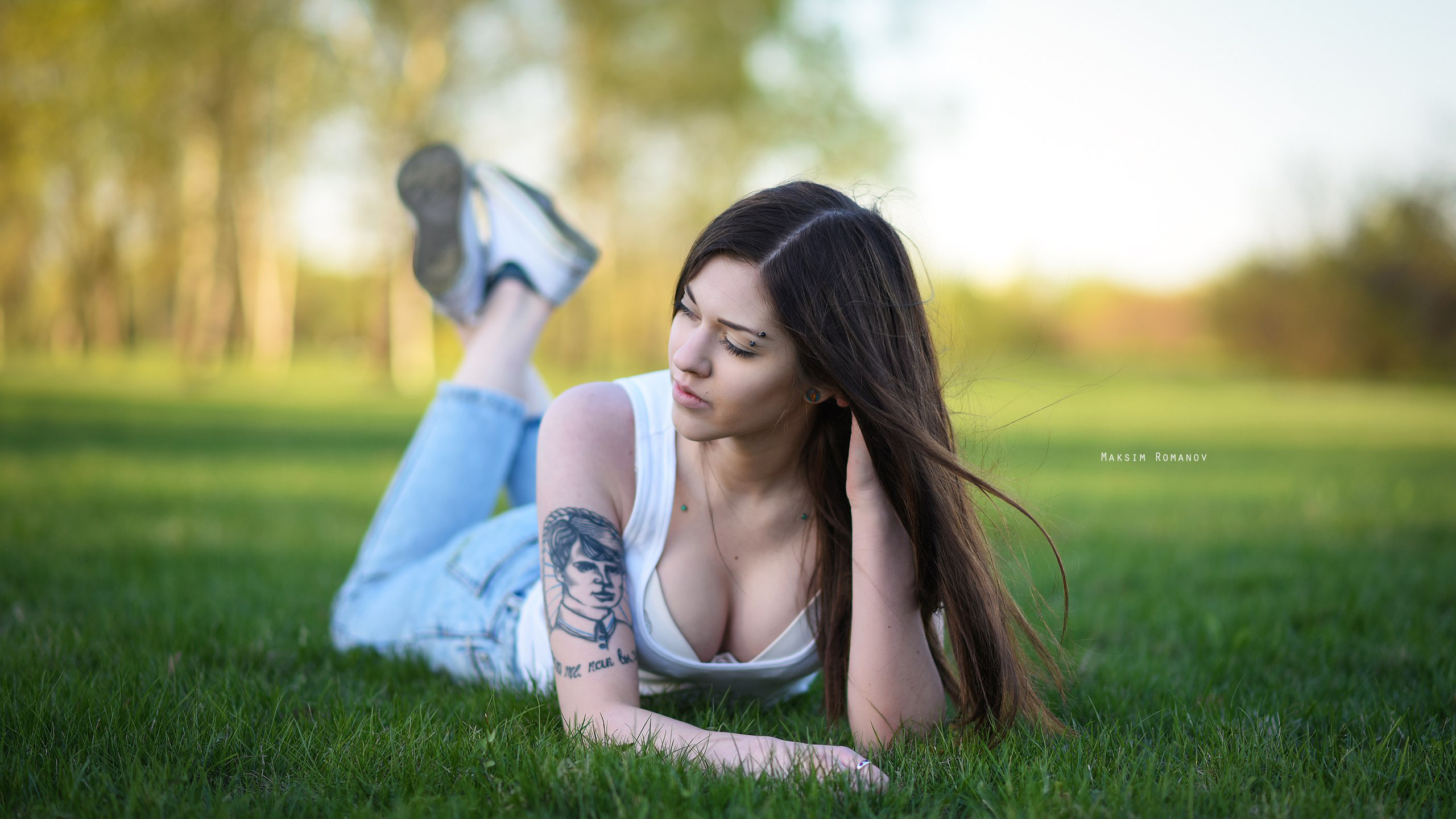 women, maksim romanov, grass, sneakers, tattoo, depth of field, pants, jeans, lying on front, women outdoors, piercing, ,  , , , , , ,   ,   , ,  