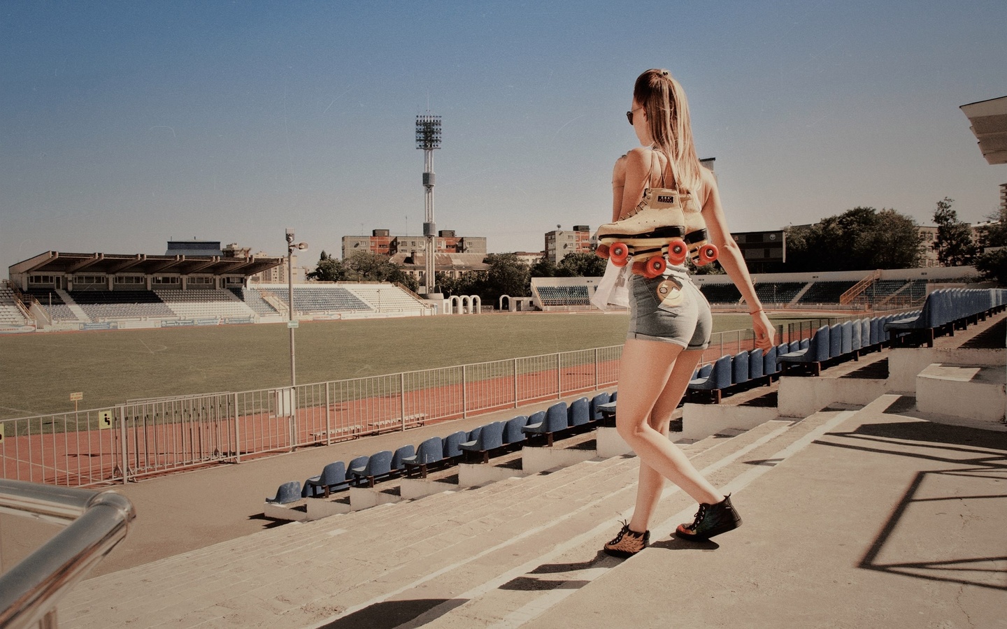 women, blonde, rollerskates, jean shorts, t-shirt, women outdoors, sneakers, stadium, sunglasses