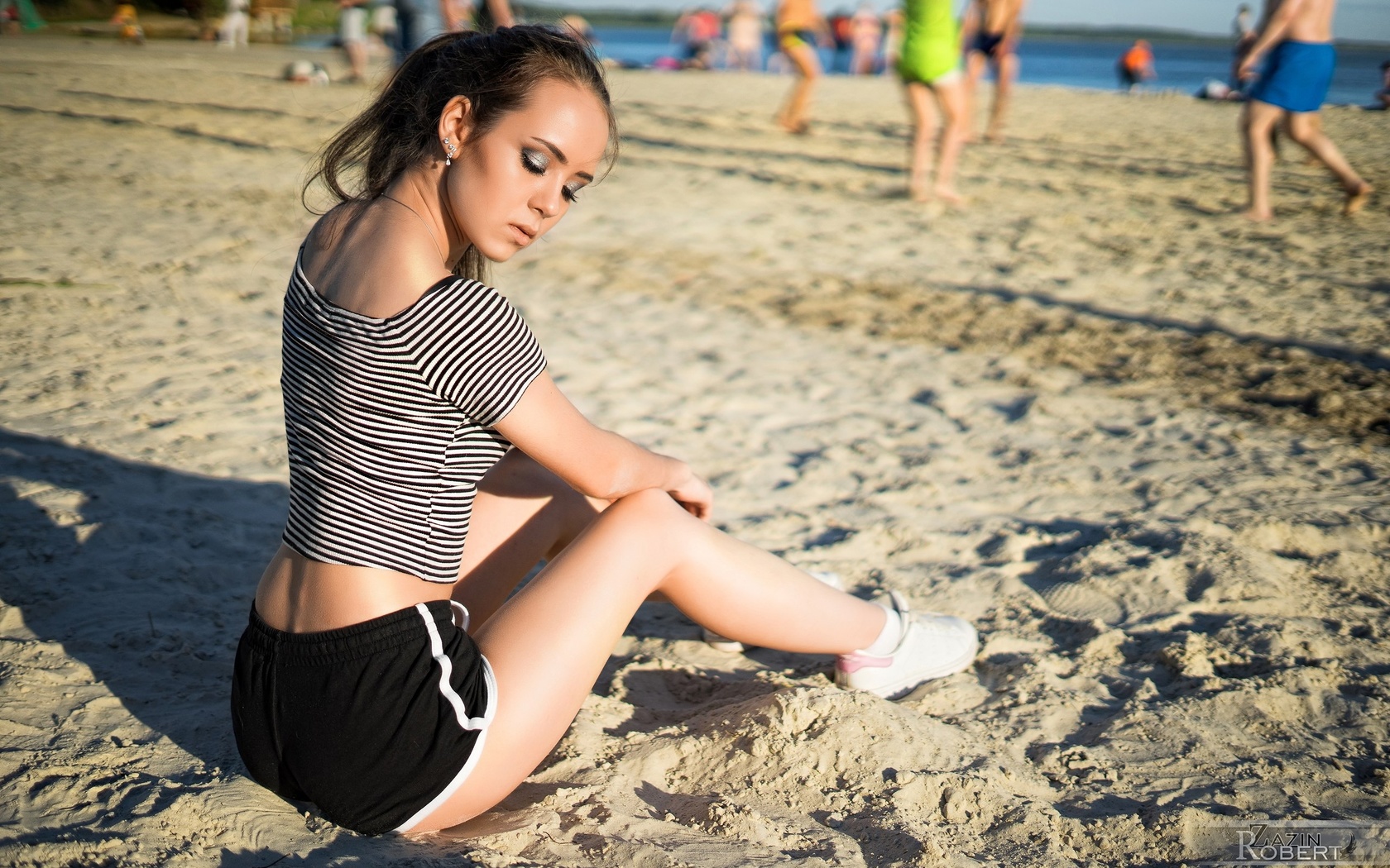 women, sitting, sneakers, sand, sea, shorts, short shorts, women outdoors, closed eyes, depth of field, 