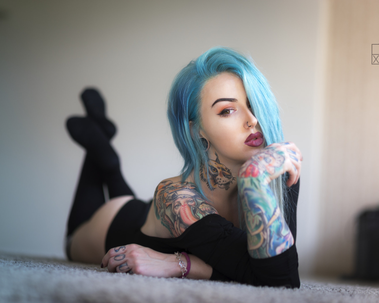 women, dyed hair, lying on front, tattoo, ass, black stockings, leotard, portrait, on the floor, nose rings, eyeliner, painted nails, depth of field