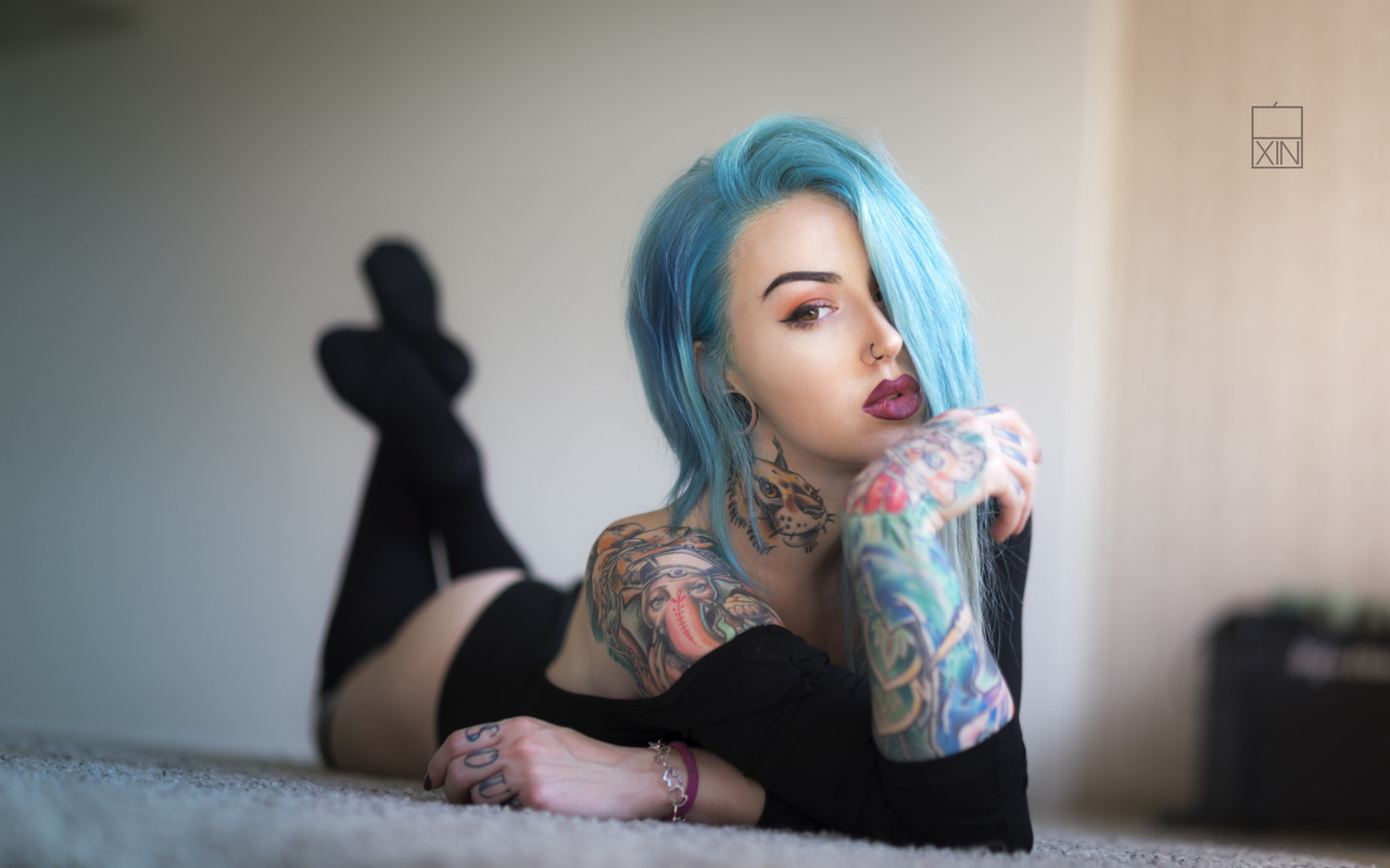 women, dyed hair, lying on front, tattoo, ass, black stockings, leotard, portrait, on the floor, nose rings, eyeliner, painted nails, depth of field