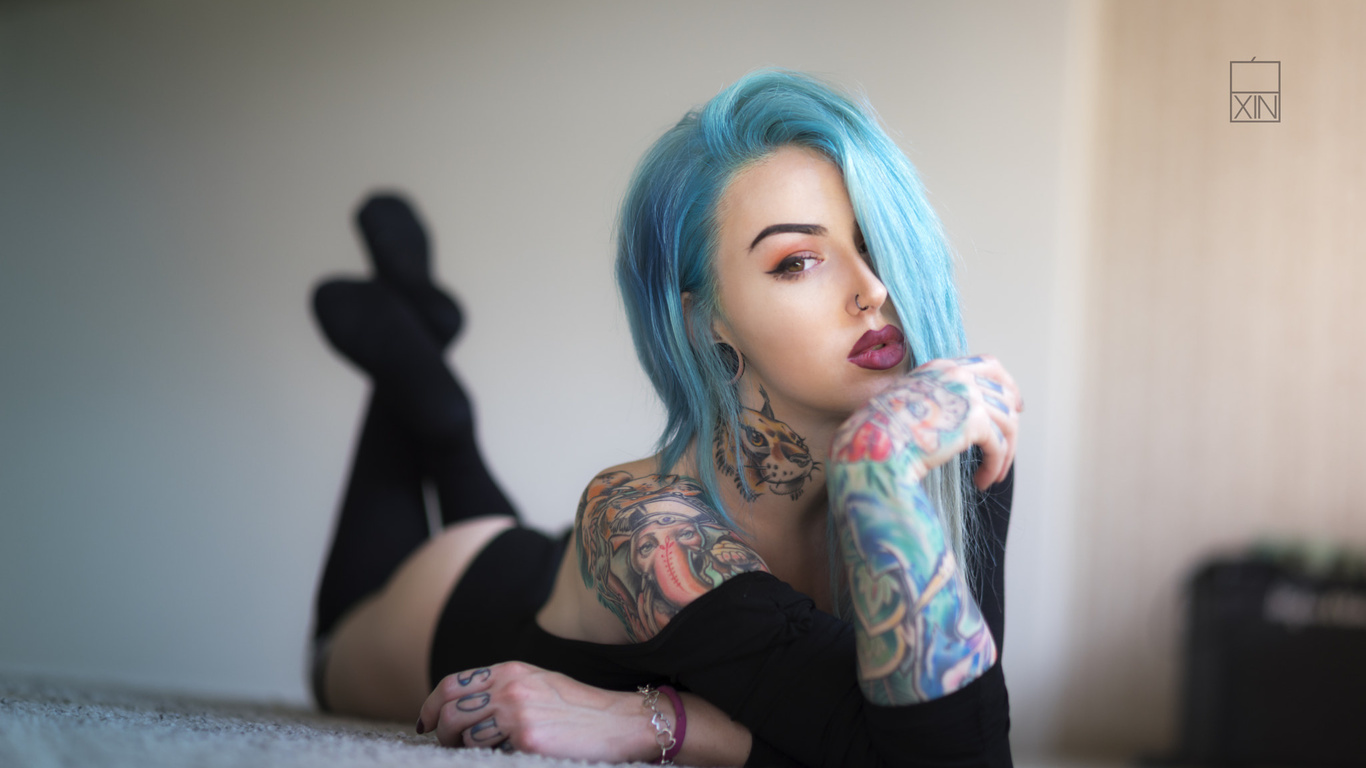 women, dyed hair, lying on front, tattoo, ass, black stockings, leotard, portrait, on the floor, nose rings, eyeliner, painted nails, depth of field