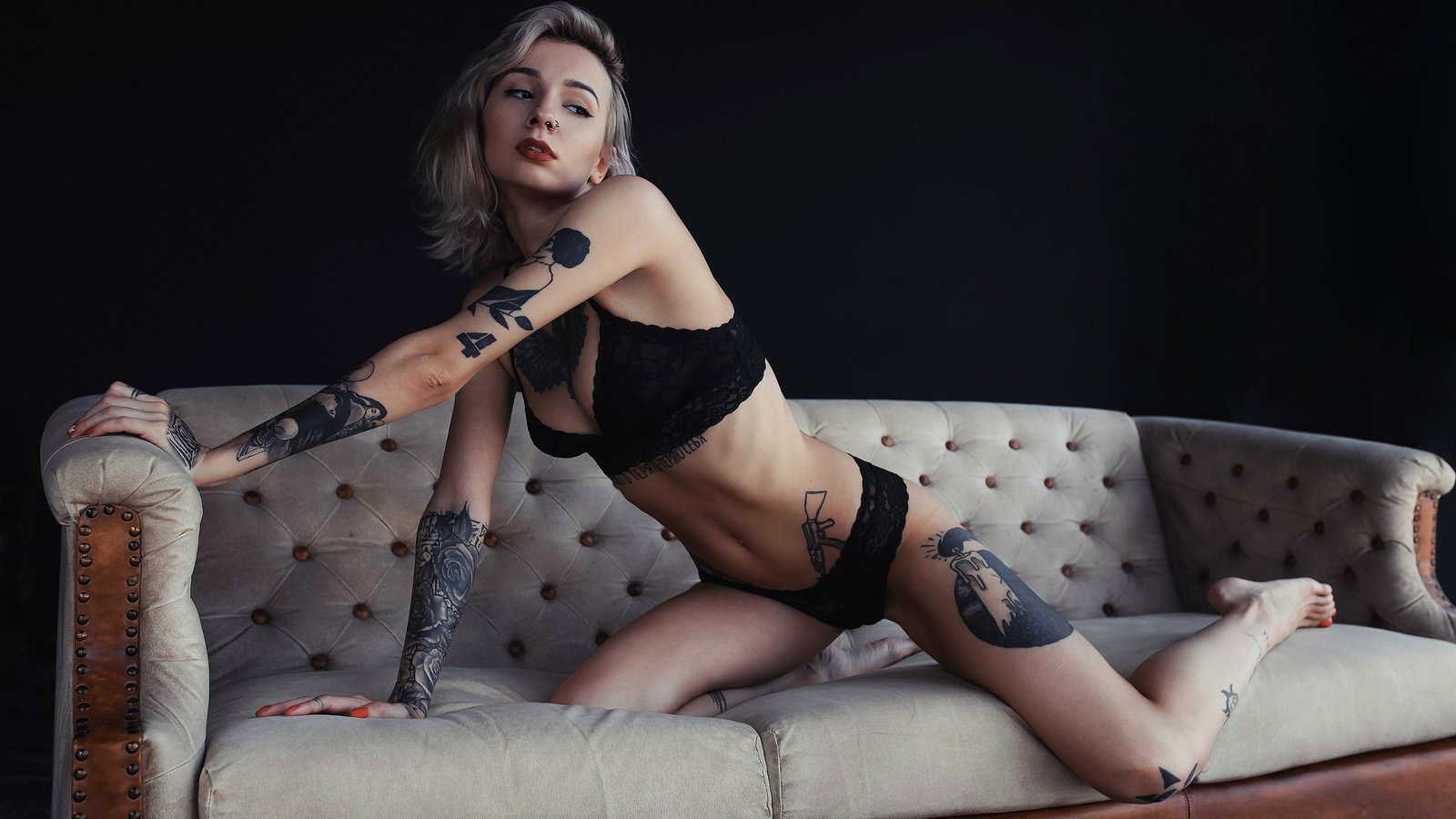 women, red lipstick, black lingerie, tattoo, couch, red nails, belly, kneeling, nose rings, looking away