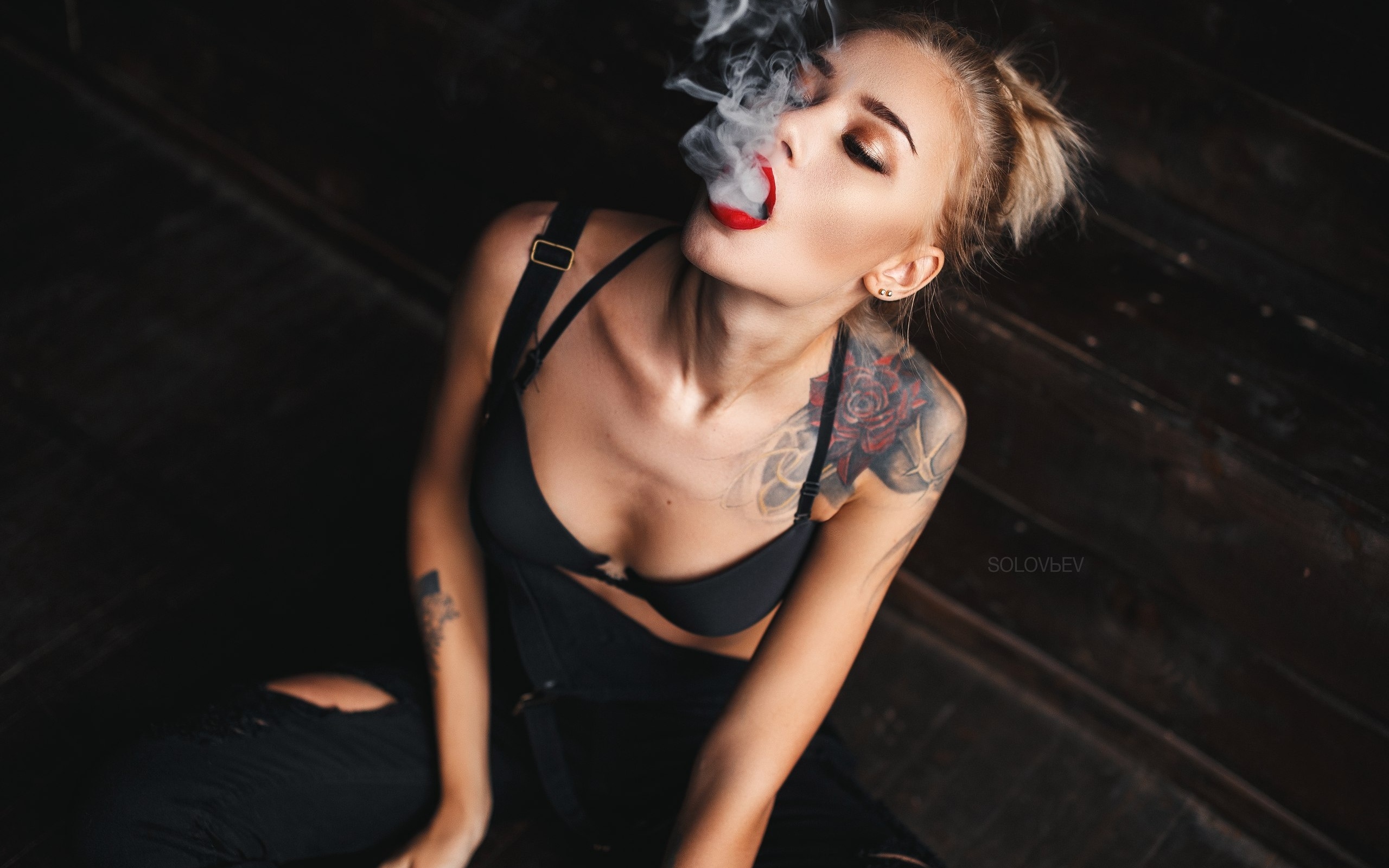 alina ostraya, women, tanned, smoke, tattoo, black bras, red lipstick, sitting, overalls, blonde, open mouth