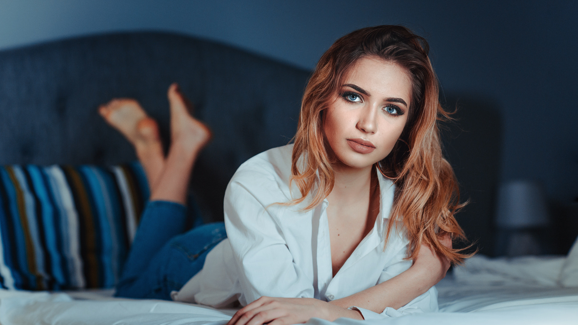 women, redhead, jeans, red nails, shirt, in bed, blue eyes, depth of field, lying on front