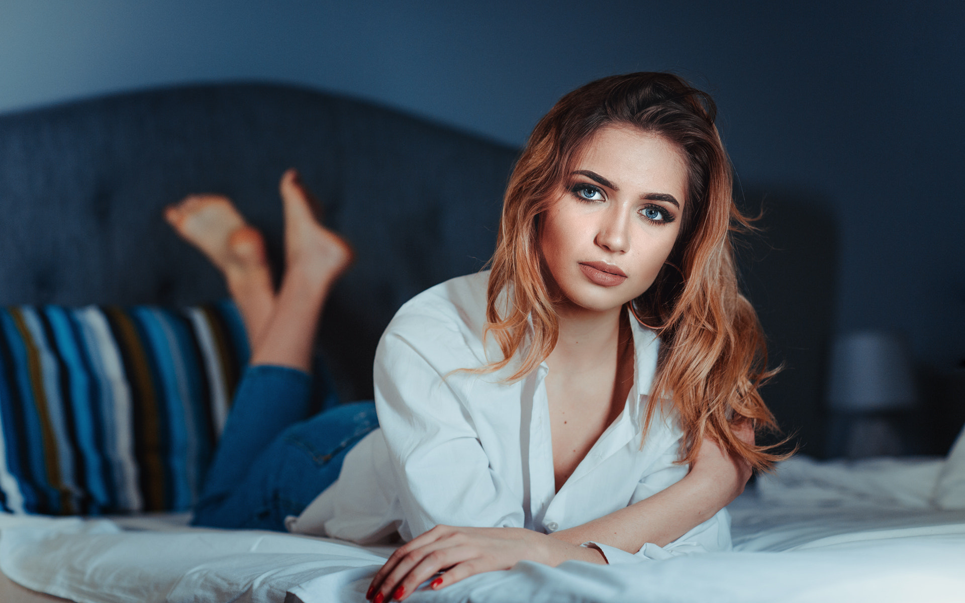 women, redhead, jeans, red nails, shirt, in bed, blue eyes, depth of field, lying on front