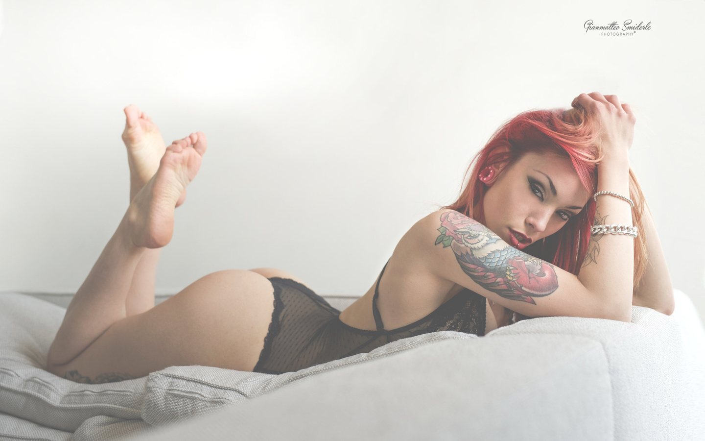 women, redhead, ass, tattoo, black lingerie, lying on front, pierced lip, brunette