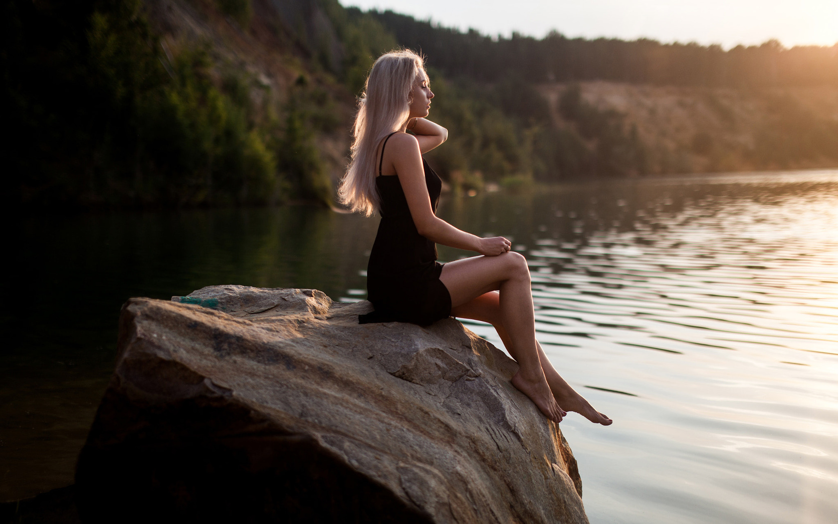 women, sitting, blonde, tanned, rocks, depth of field, black dress, women outdoors, brunette, water