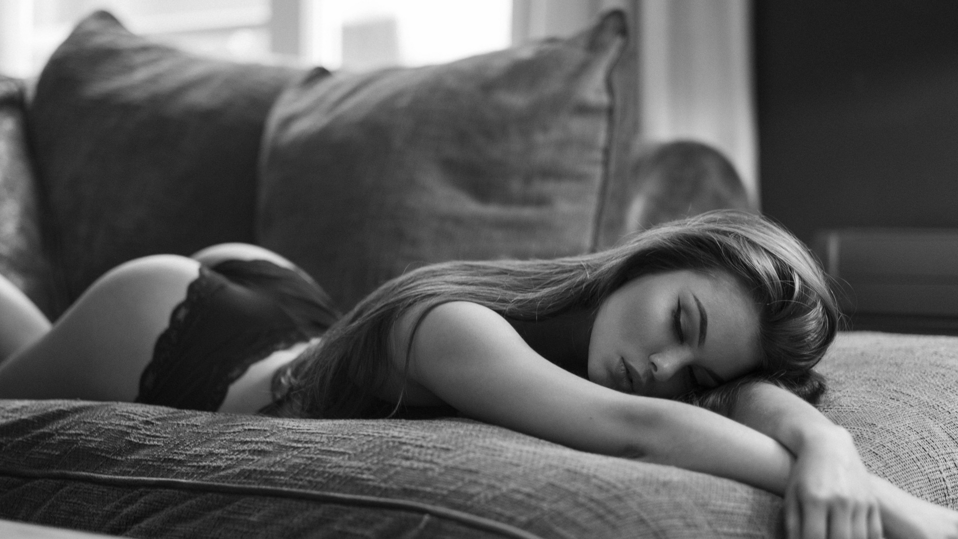 women, eyeliner, black lingerie, ass, couch, lying on front, closed eyes, monochrome, long hair