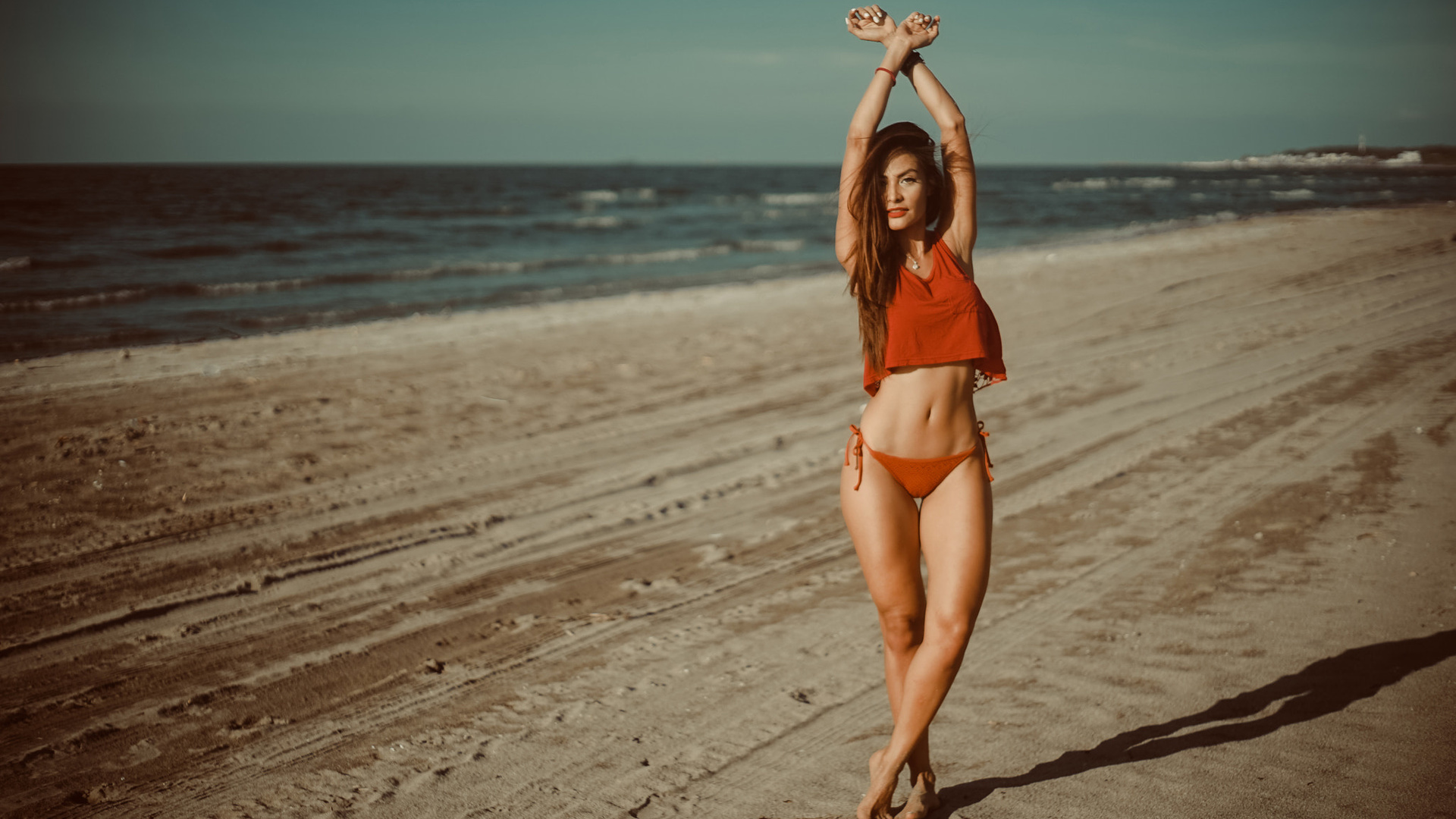 women, sea, beach, sand, women outdoors, belly, arms up, white nails, swimwear, the gap, necklace, red bikini, red lipstick