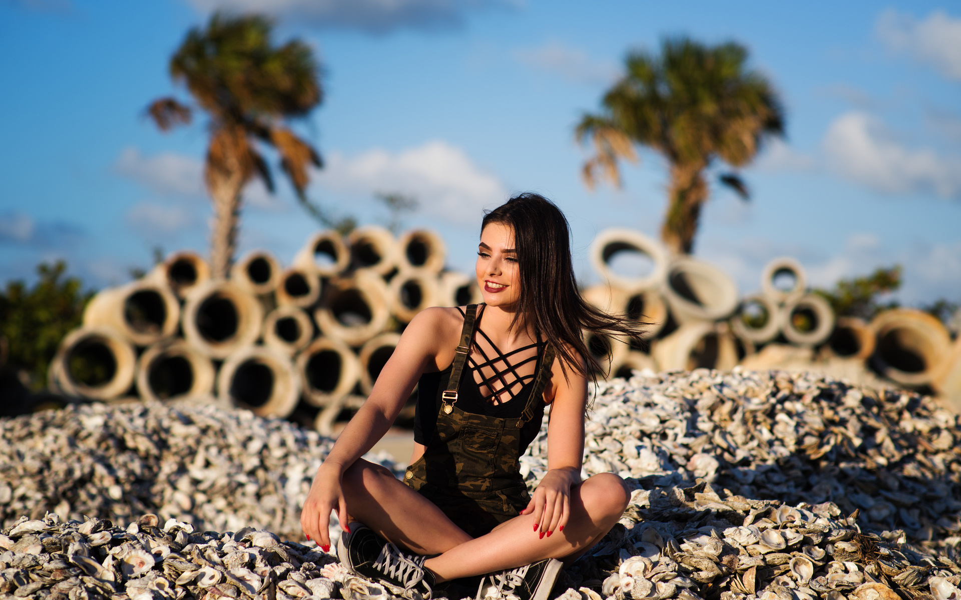 women, smiling, sneakers, palm trees, red nails, overalls, women outdoors, brunette, depth of field, looking away