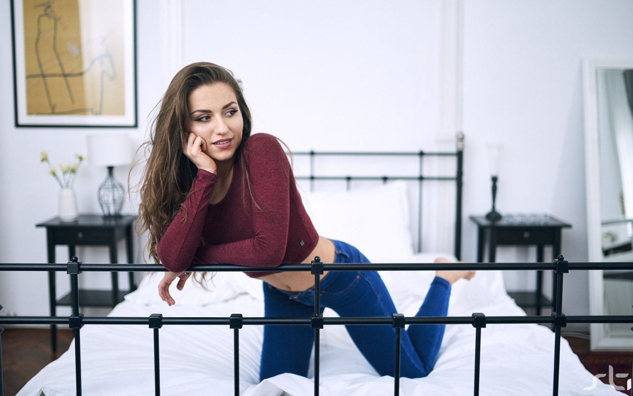 women, in bed, belly, jeans, pillow, kneeling, pink lipstick, brunette