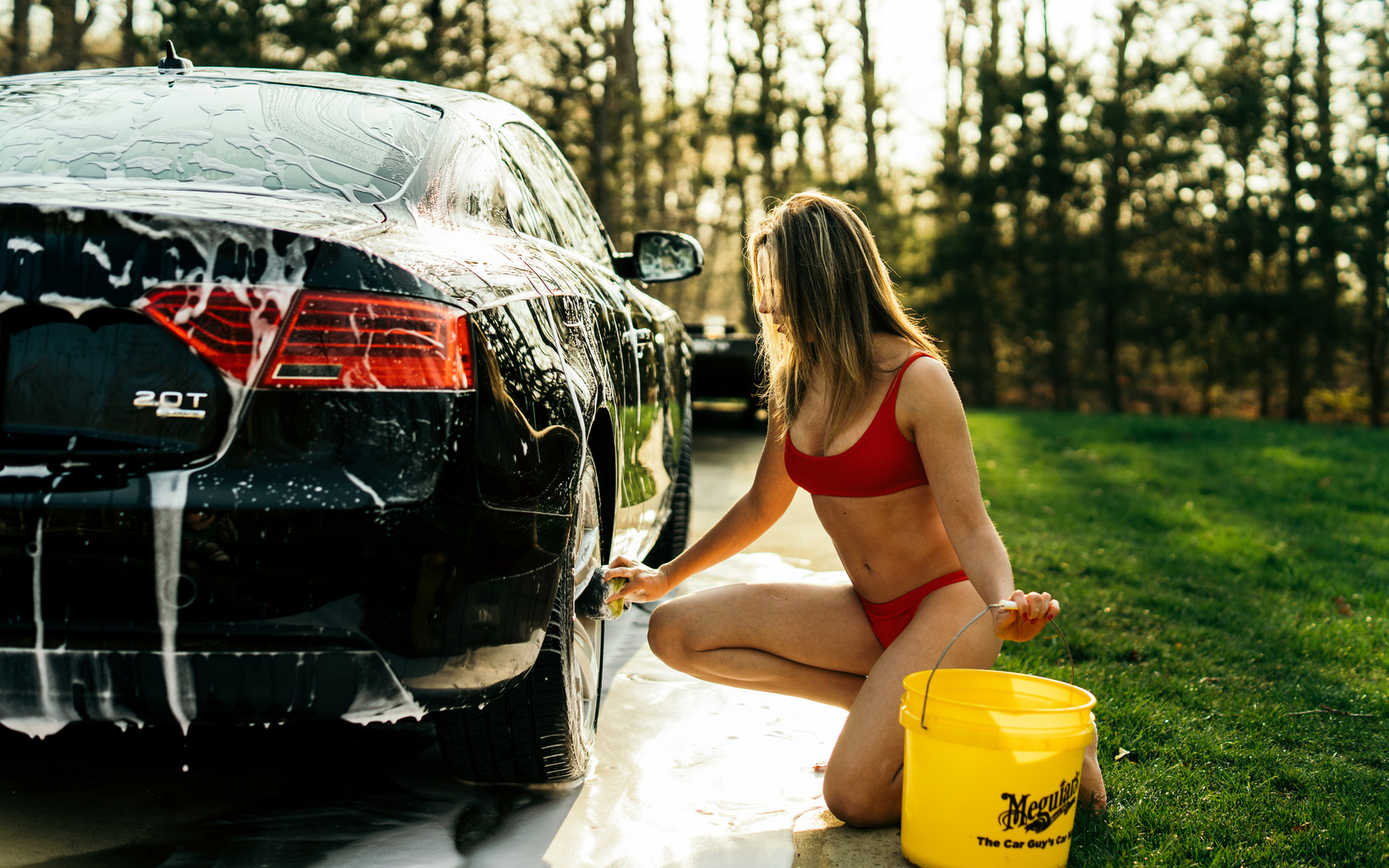 women, car washes, blonde, women with cars, women outdoors, belly, swimwear, brunette, grass, trees, red nails, red tops, bucket, soap, kneeling