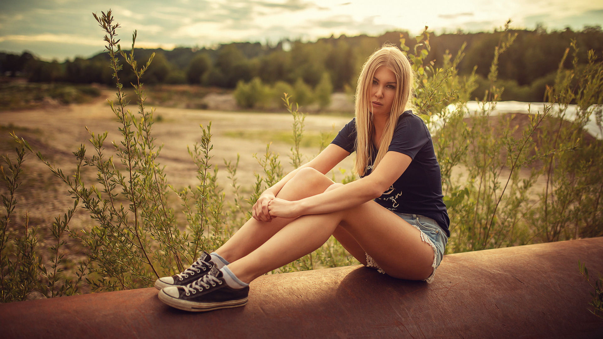 women, blonde, sitting, socks, jean shorts, t-shirt, sneakers, women outdoors, portrait