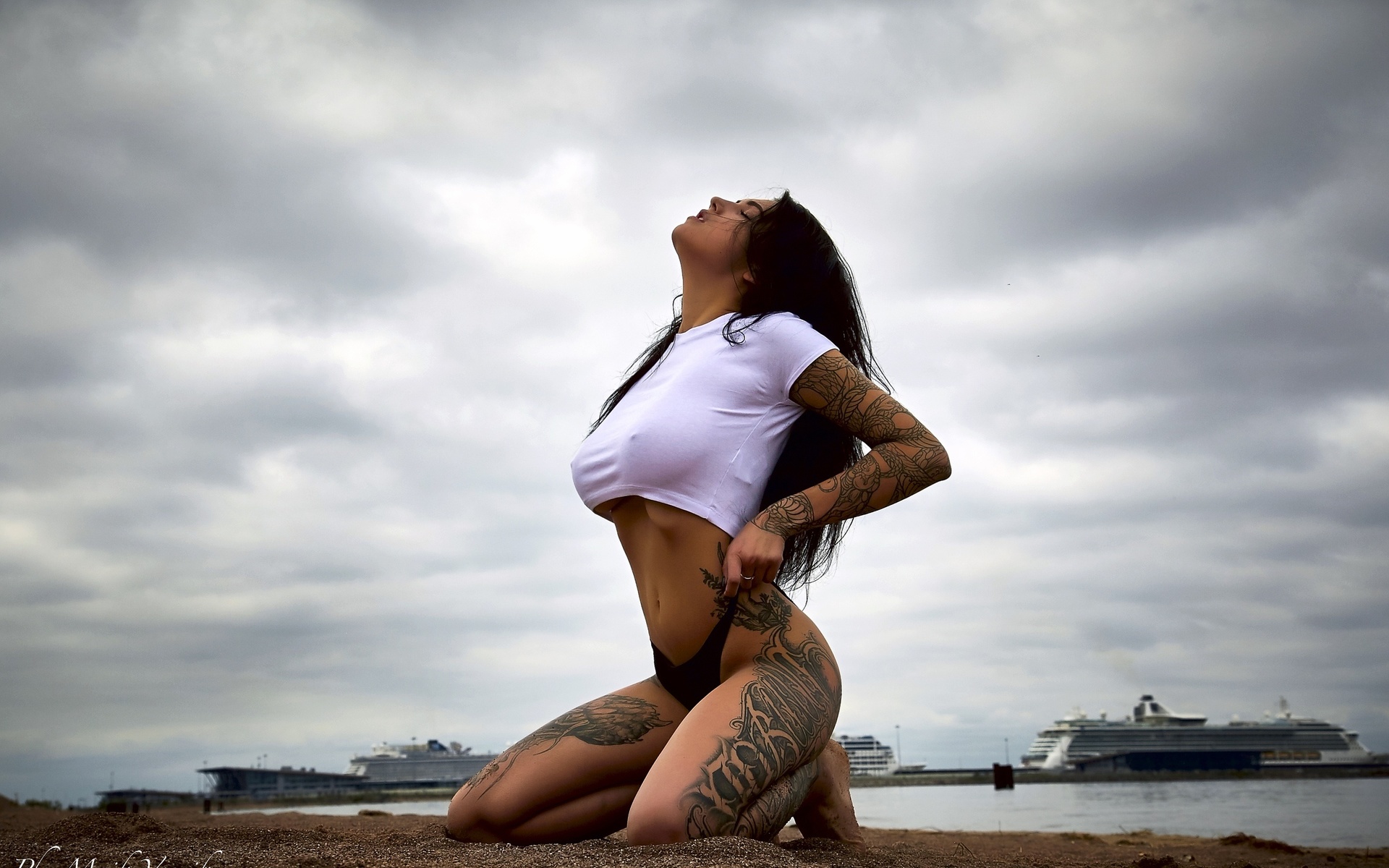 women, kneeling, t-shirt, thong, closed eyes, belly, tattoo, long hair, women outdoors, nipples through clothing, tanned